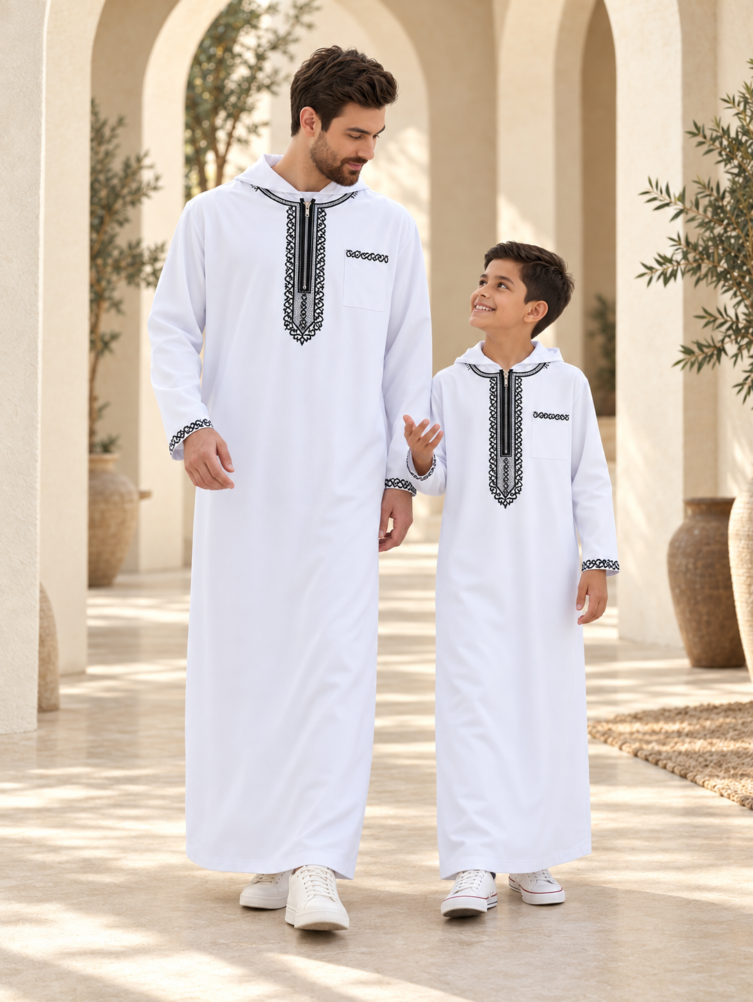 Father & Son Matching White Hooded Thobes with Black Embroidery – Zip-Neck Robes for Eid & Family Gatherings